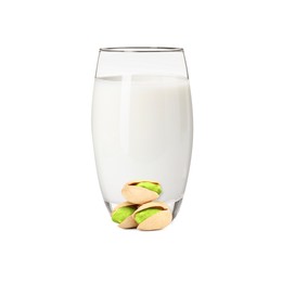Image of Nut milk in glass and pistachios isolated on white