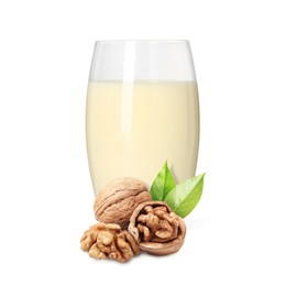 Image of Nut milk in glass and walnuts isolated on white
