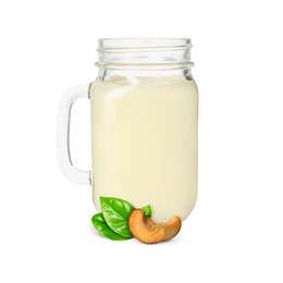 Image of Nut milk in glass jar and cashews isolated on white