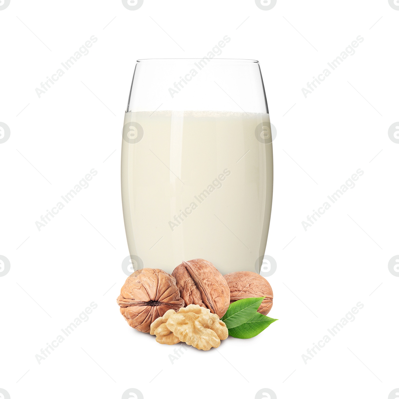 Nut milk in glass and walnuts isolated on white Image of Nut milk in glass and walnuts isolated on white