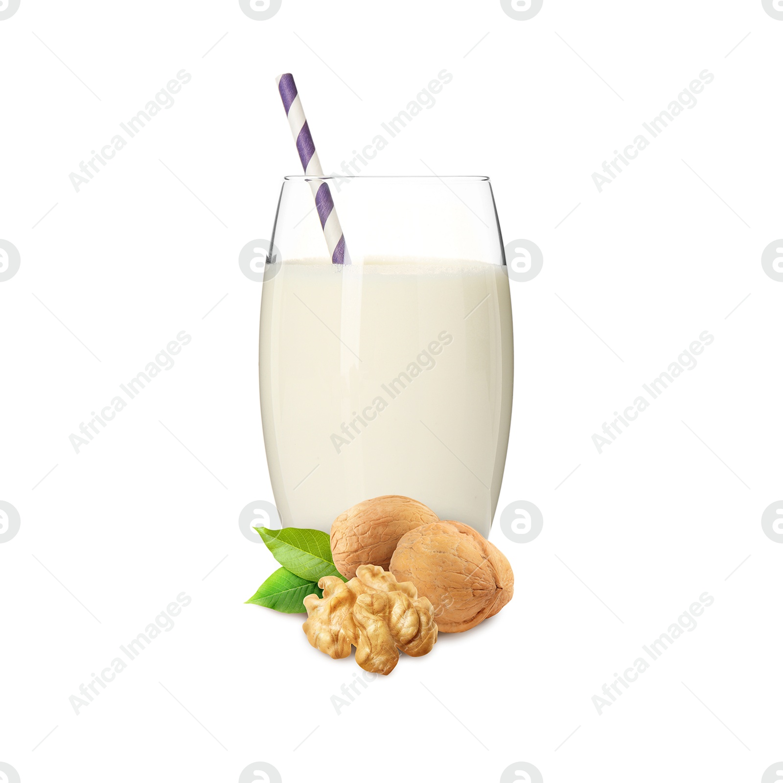 Nut milk in glass and walnuts isolated on white Image of Nut milk in glass and walnuts isolated on white