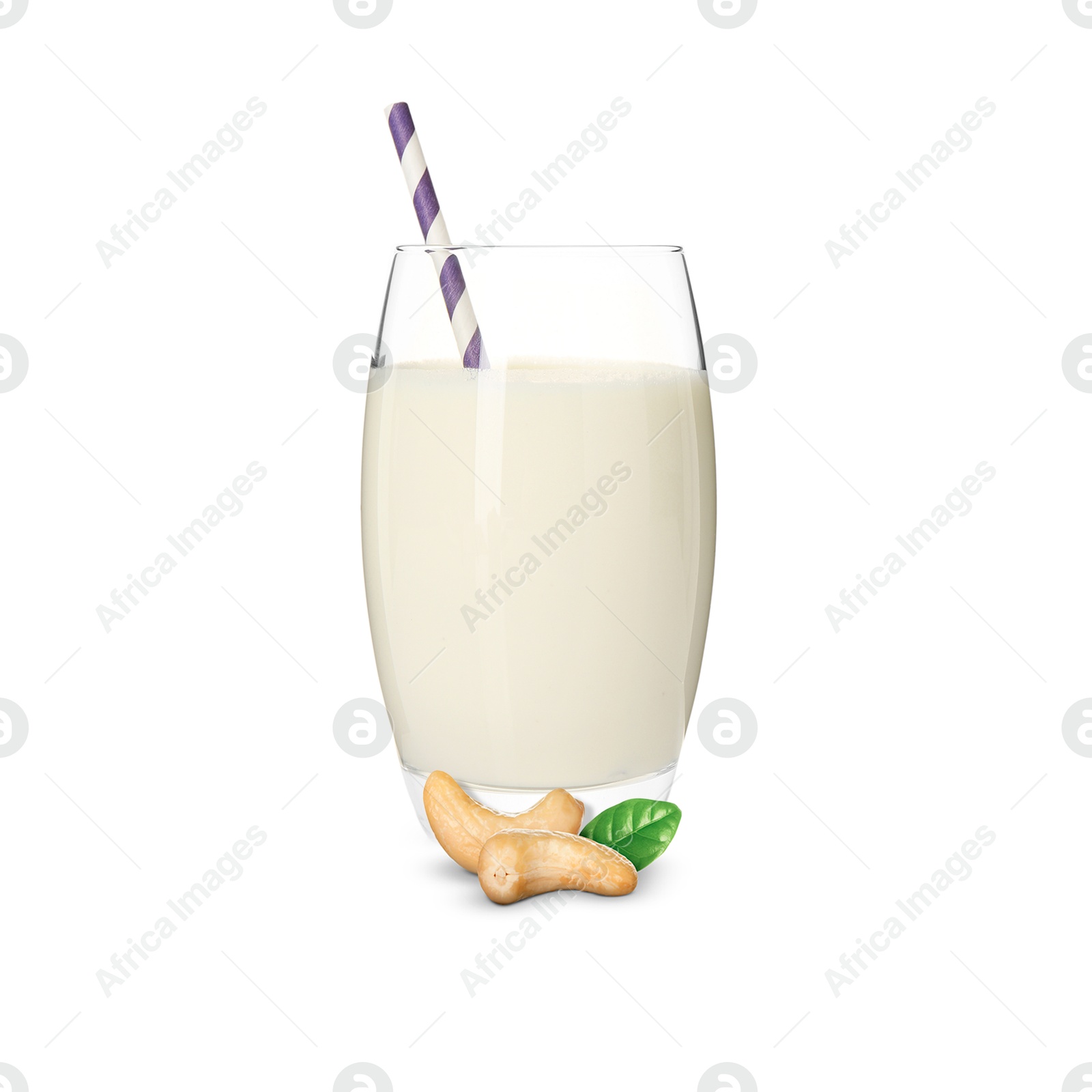 Nut milk in glass and cashews isolated on white Image of Nut milk in glass and cashews isolated on white