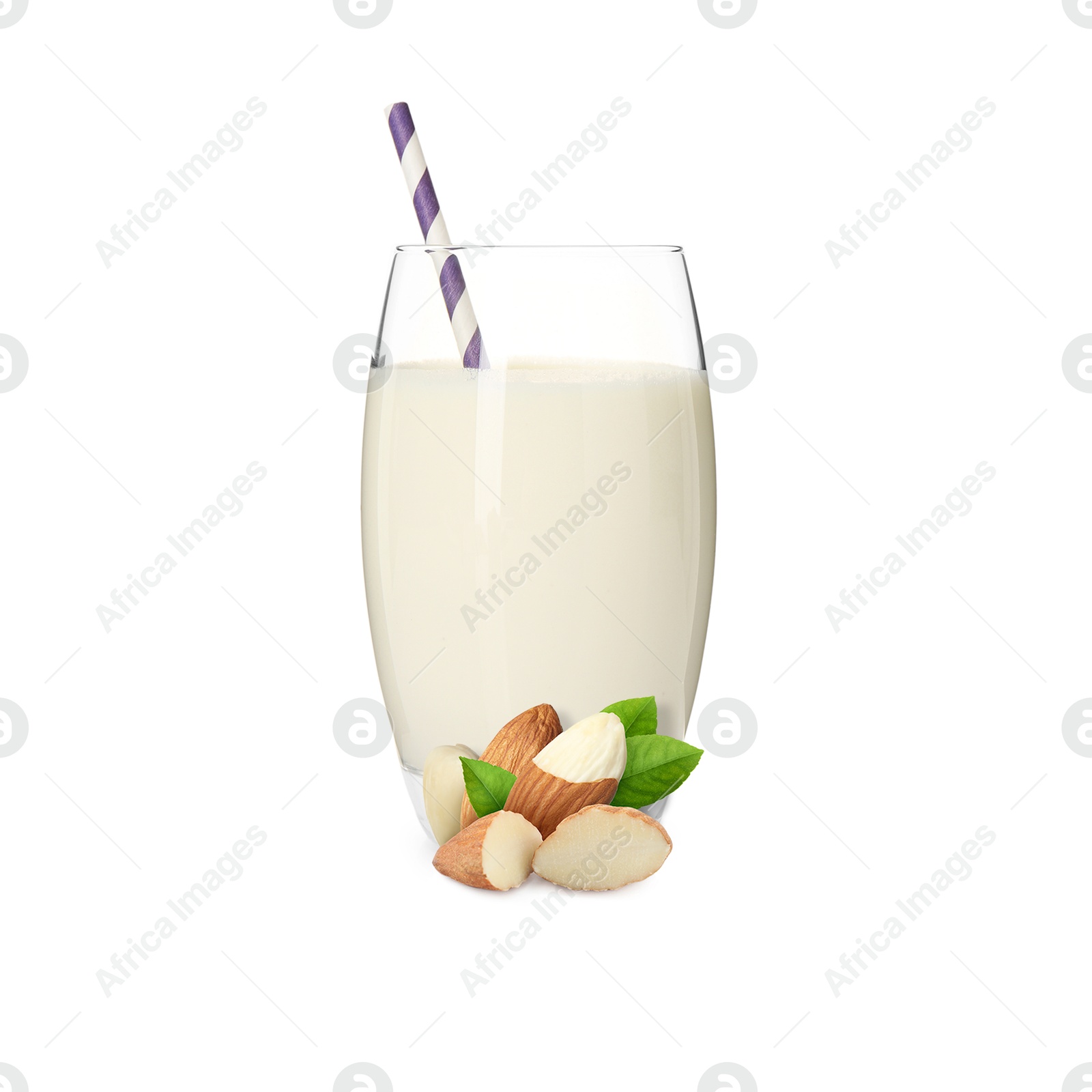 Nut milk in glass and almonds isolated on white Image of Nut milk in glass and almonds isolated on white