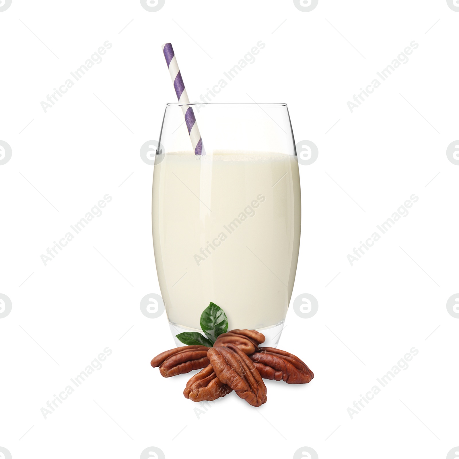 Nut milk in glass and pecans isolated on white Image of Nut milk in glass and pecans isolated on white
