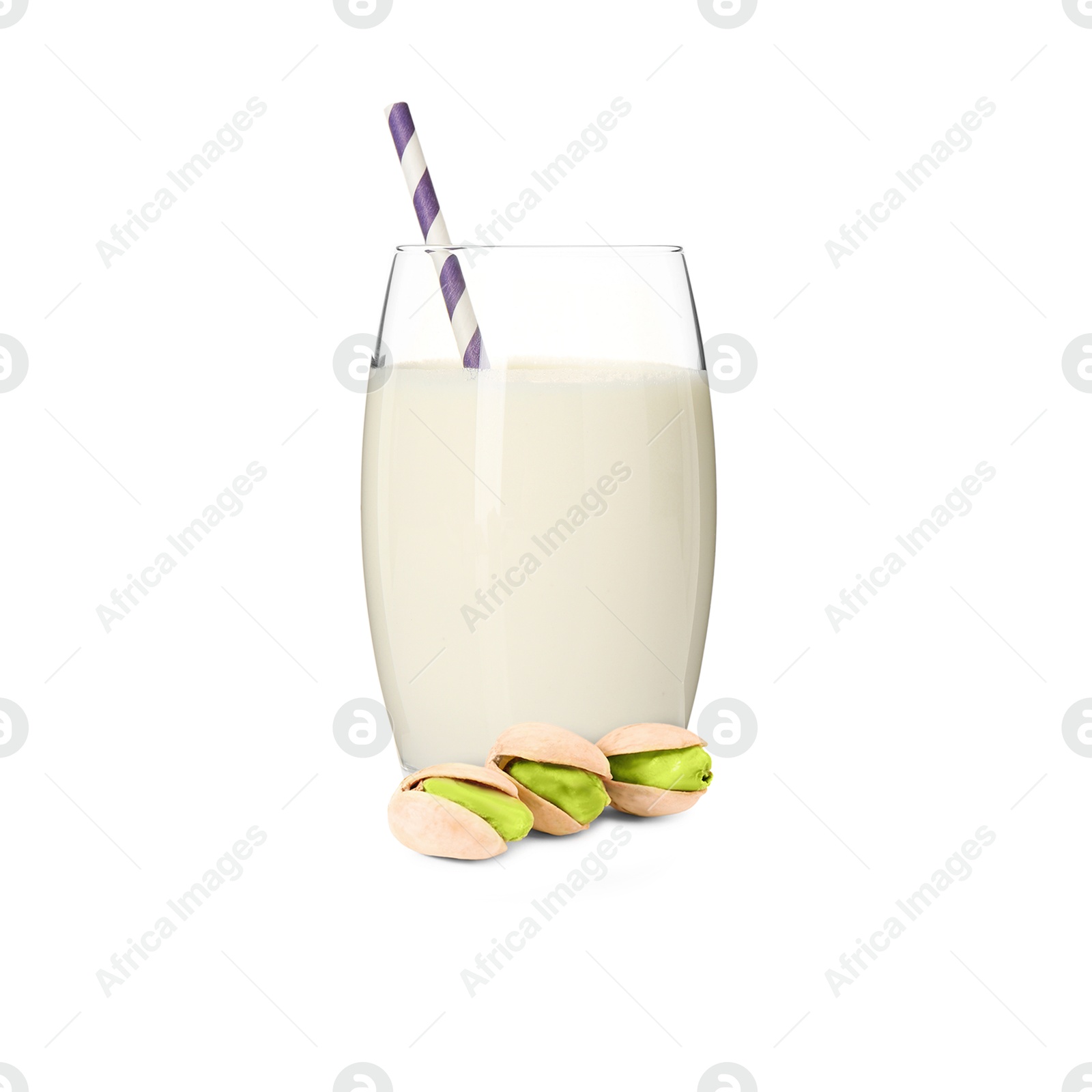 Nut milk in glass and pistachios isolated on white Image of Nut milk in glass and pistachios isolated on white