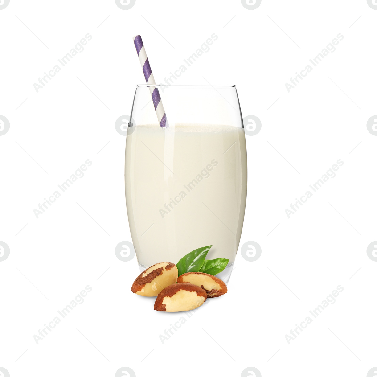 Nut milk in glass and Brazil nuts isolated on white Image of Nut milk in glass and Brazil nuts isolated on white