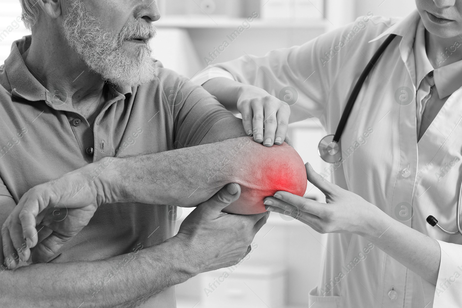 Arthritis. Doctor examining patient's elbow in hospital, closeup. Black and white toning with red color accent Image of Arthritis. Doctor examining patient's elbow in hospital, closeup. Black and white toning with red color accent