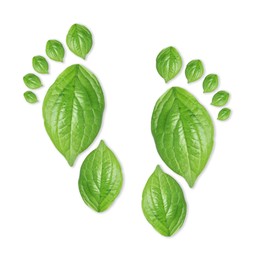 Image of Human footprints made of green leaves on white background, top view. Environmental care, ecology protection, reducing CO2 emission