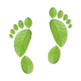 Image of Human footprints made of green leaves on white background, top view. Environmental care, ecology protection, reducing CO2 emission