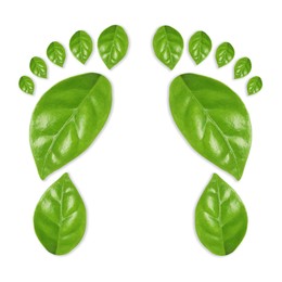 Image of Human footprints made of green leaves on white background, top view. Environmental care, ecology protection, reducing CO2 emission