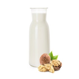 Image of Nut milk in glass bottle and walnuts isolated on white
