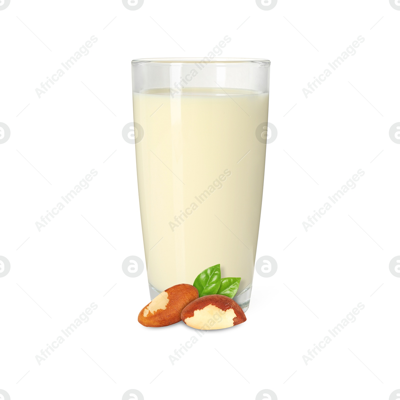 Nut milk in glass and Brazil nuts isolated on white Image of Nut milk in glass and Brazil nuts isolated on white