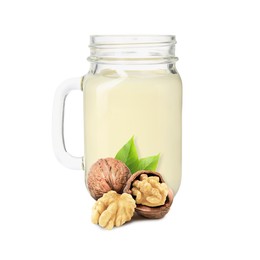 Image of Nut milk in glass jar and walnuts isolated on white