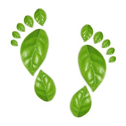 Image of Human footprints made of green leaves on white background, top view. Environmental care, ecology protection, reducing CO2 emission
