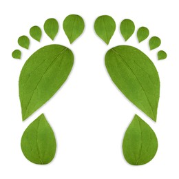 Image of Human footprints made of green leaves on white background, top view. Environmental care, ecology protection, reducing CO2 emission