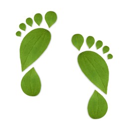 Image of Human footprints made of green leaves on white background, top view. Environmental care, ecology protection, reducing CO2 emission