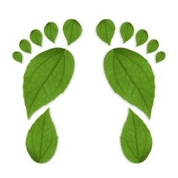 Image of Human footprints made of green leaves on white background, top view. Environmental care, ecology protection, reducing CO2 emission