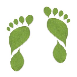 Image of Human footprints made of green leaves on white background, top view. Environmental care, ecology protection, reducing CO2 emission