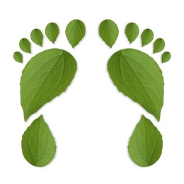Image of Human footprints made of green leaves on white background, top view. Environmental care, ecology protection, reducing CO2 emission