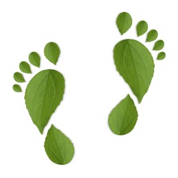 Image of Human footprints made of green leaves on white background, top view. Environmental care, ecology protection, reducing CO2 emission