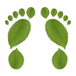 Image of Human footprints made of green leaves on white background, top view. Environmental care, ecology protection, reducing CO2 emission