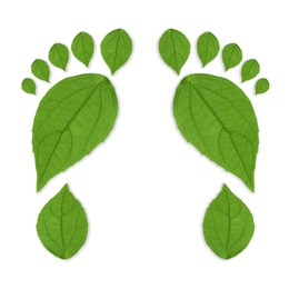 Image of Human footprints made of green leaves on white background, top view. Environmental care, ecology protection, reducing CO2 emission
