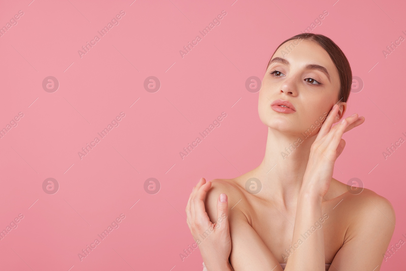 Portrait of beautiful young woman on pink background. Space for text Photo of Portrait of beautiful young woman on pink background. Space for text