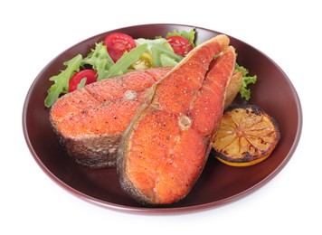 Photo of Seafood. Tasty salmon steaks, salad and lemon isolated on white