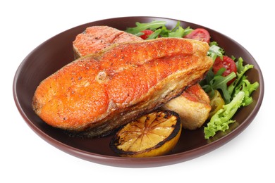 Photo of Seafood. Tasty salmon steaks, salad and lemon isolated on white