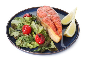 Photo of Seafood. Tasty salmon steak, salad and lemon isolated on white