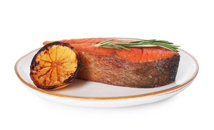 Photo of Seafood. Tasty salmon steak, lemon and rosemary isolated on white
