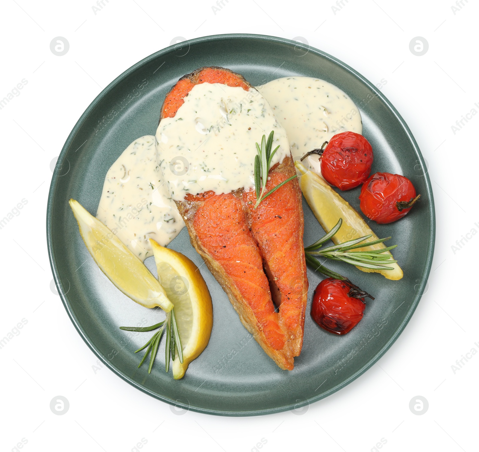 Seafood. Tasty salmon steak, sauce, tomatoes, rosemary and lemon isolated on white, top view Photo of Seafood. Tasty salmon steak, sauce, tomatoes, rosemary and lemon isolated on white, top view