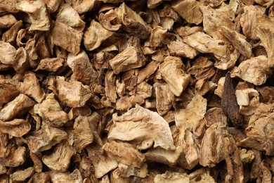 Photo of Pieces of dry chicory roots as background, closeup
