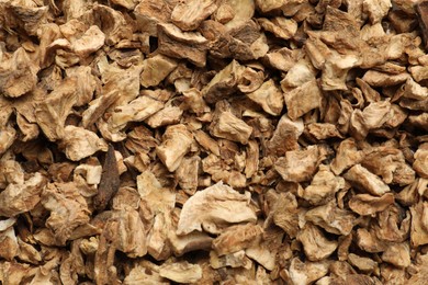Photo of Pieces of dry chicory roots as background, closeup
