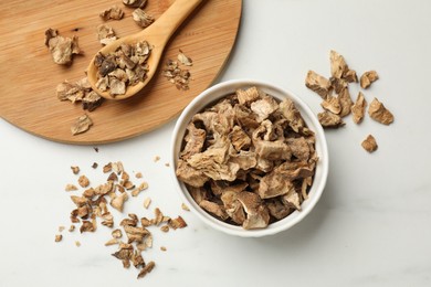 Photo of Pieces of dry chicory roots on white table, flat lay