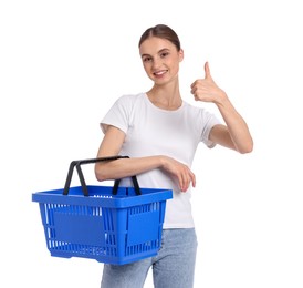 Photo of Woman with plastic shopping basket showing thumbs up on white background