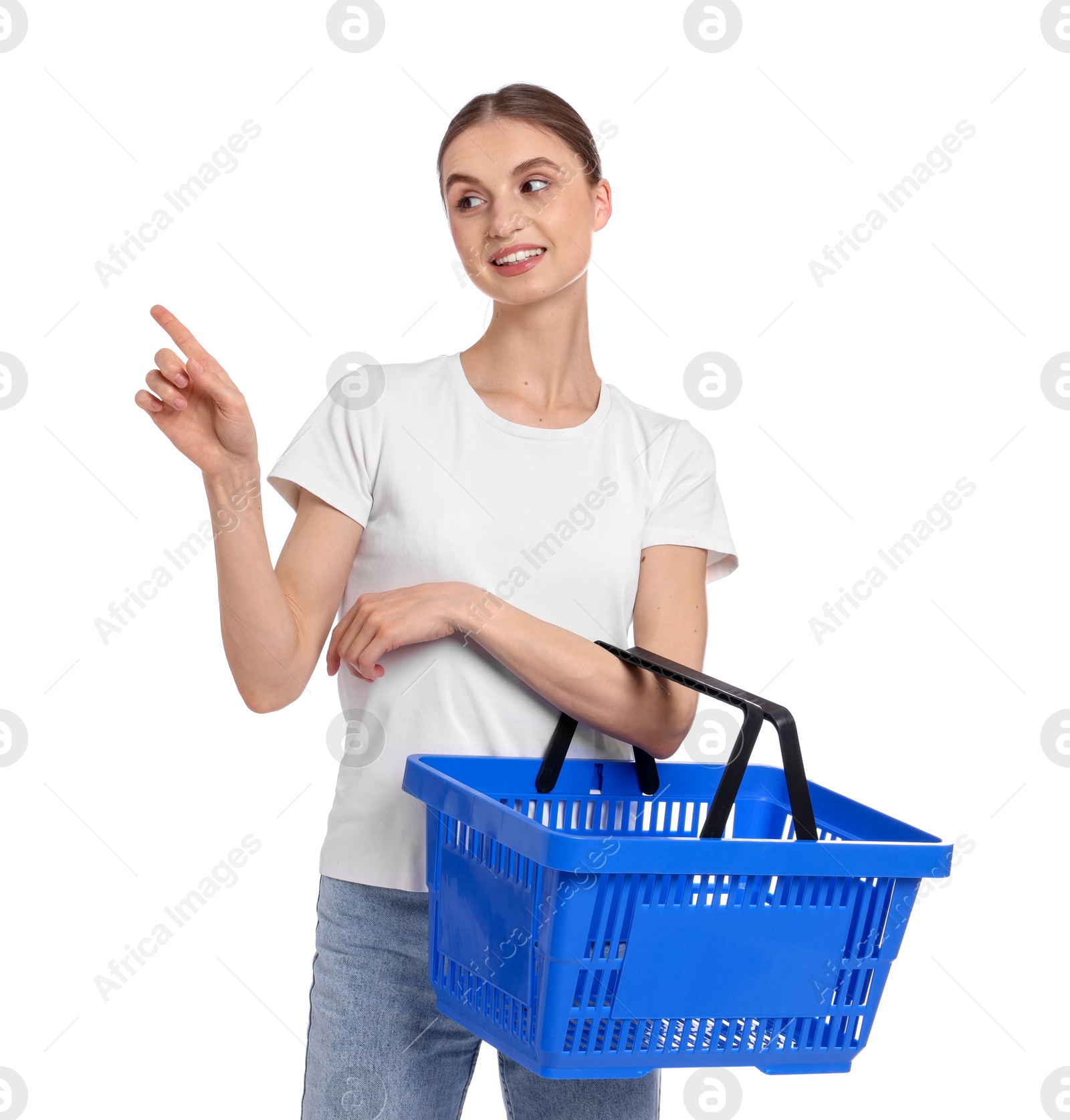 Woman with plastic shopping basket pointing at something on white background Photo of Woman with plastic shopping basket pointing at something on white background