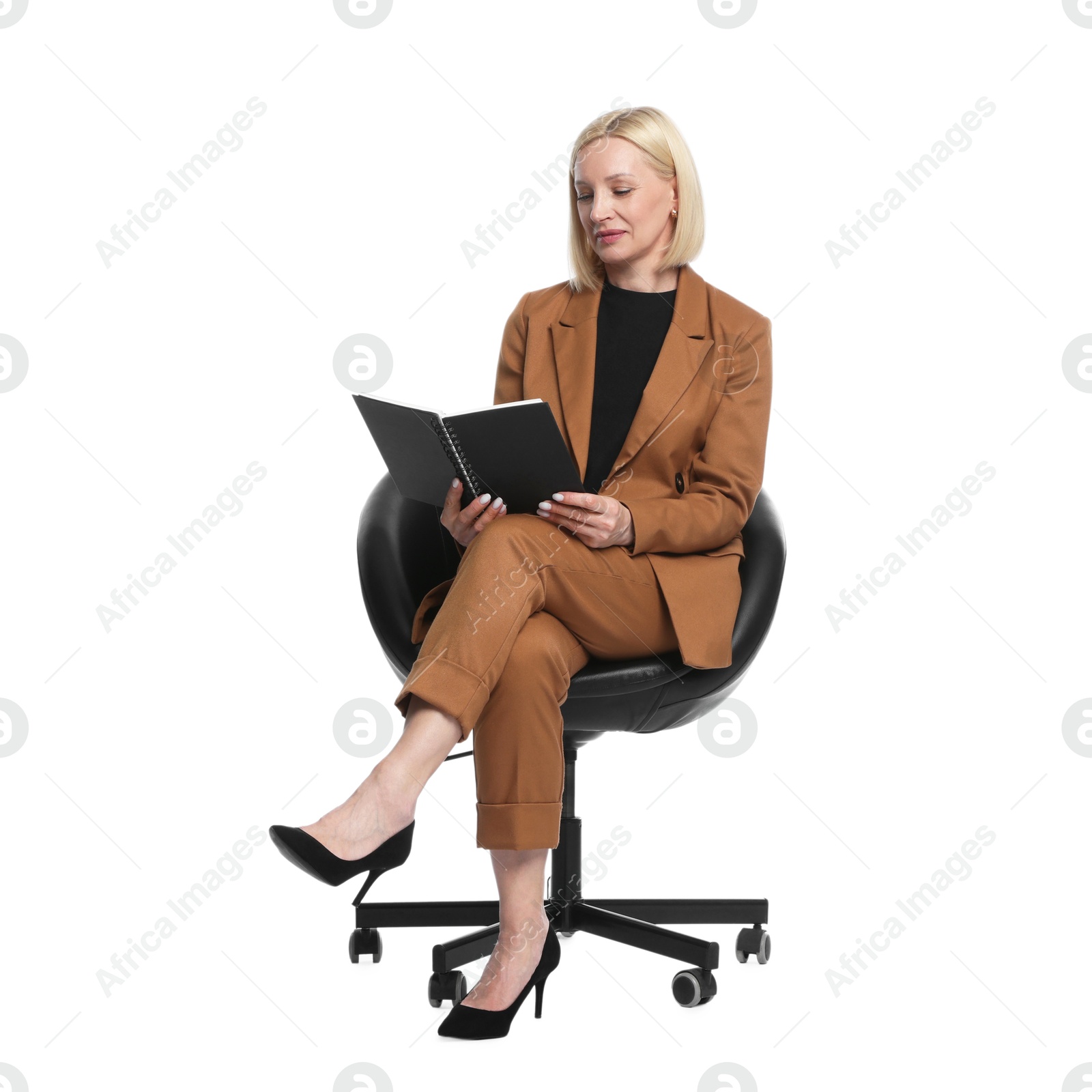 Professional psychologist with notebook in office chair on white background Photo of Professional psychologist with notebook in office chair on white background