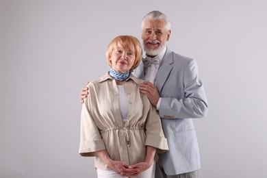 Photo of Lovely senior couple together on light grey background