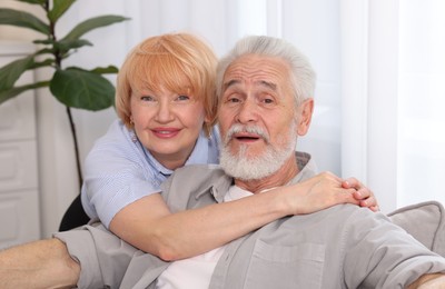 Photo of Lovely senior couple spending time together at home