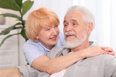Photo of Lovely senior couple spending time together at home