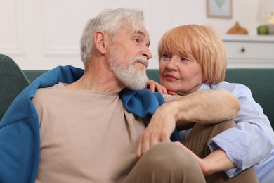 Photo of Lovely senior couple together on floor at home