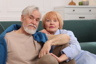 Photo of Lovely senior couple together on floor at home