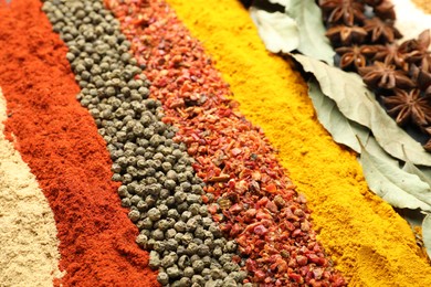 Photo of Many different aromatic spices as background, closeup