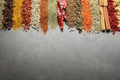 Photo of Many different spices on black table, flat lay. Space for text