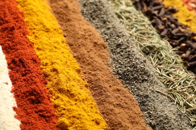 Photo of Many different aromatic spices as background, closeup