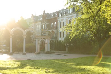 Photo of Beautiful park near residential building on sunny day