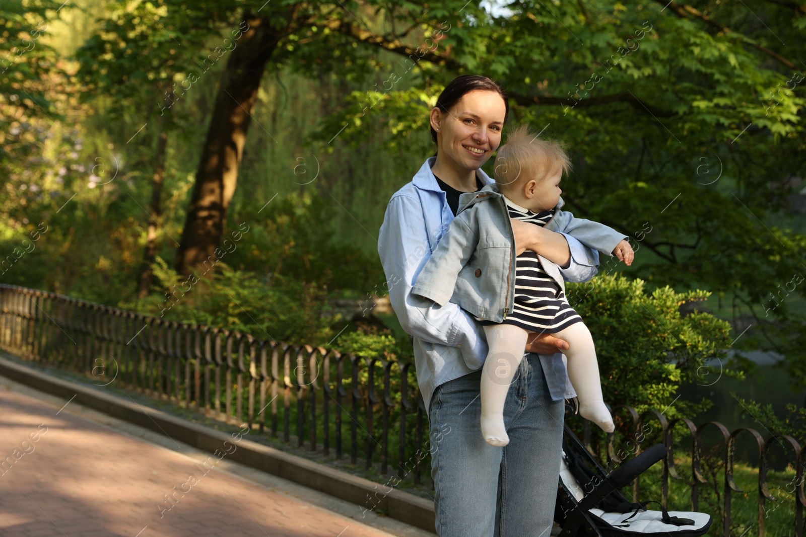 Mother with her cute baby in park Photo of Mother with her cute baby in park