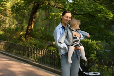 Photo of Mother with her cute baby in park
