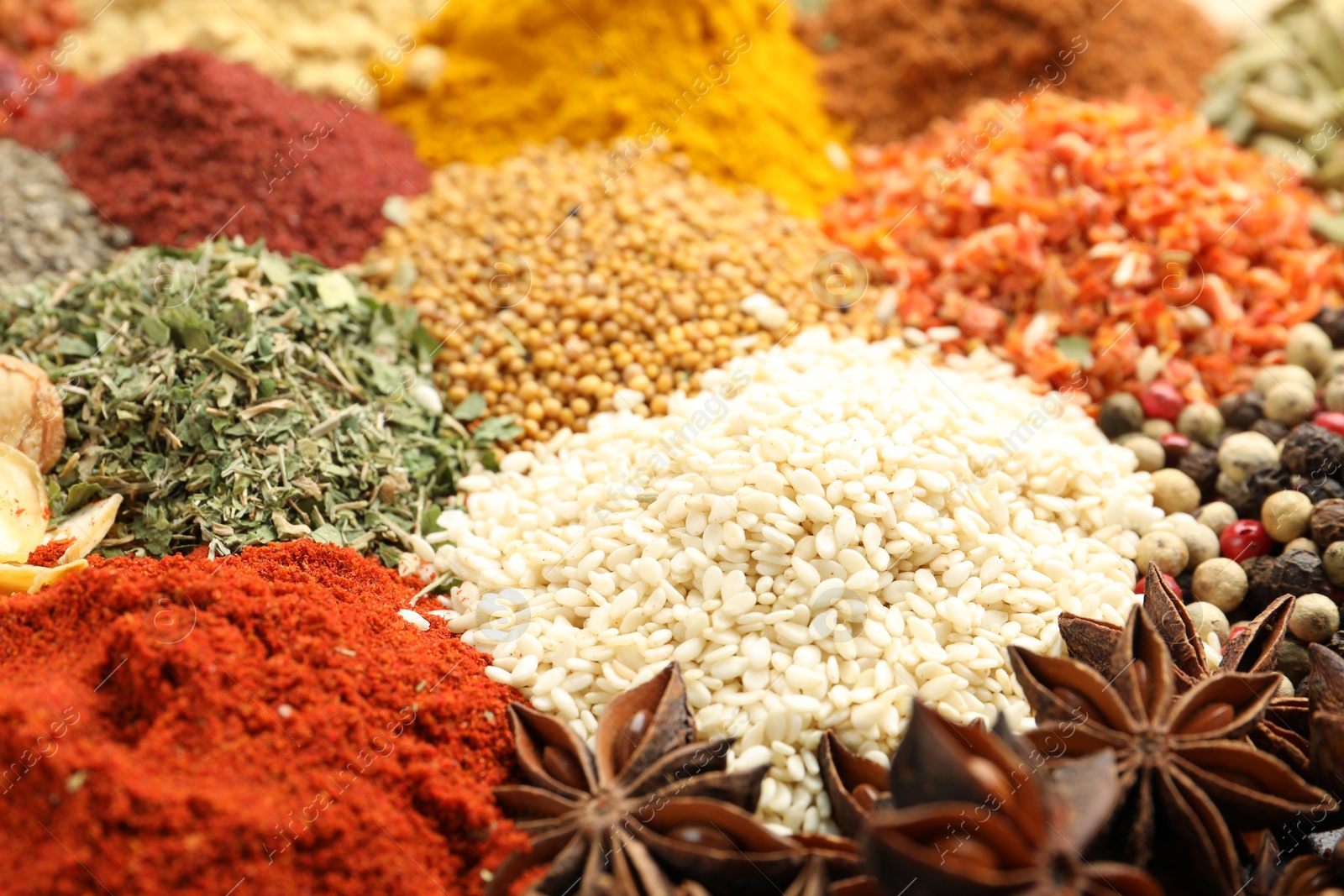 Different aromatic spices as background, closeup view Photo of Different aromatic spices as background, closeup view